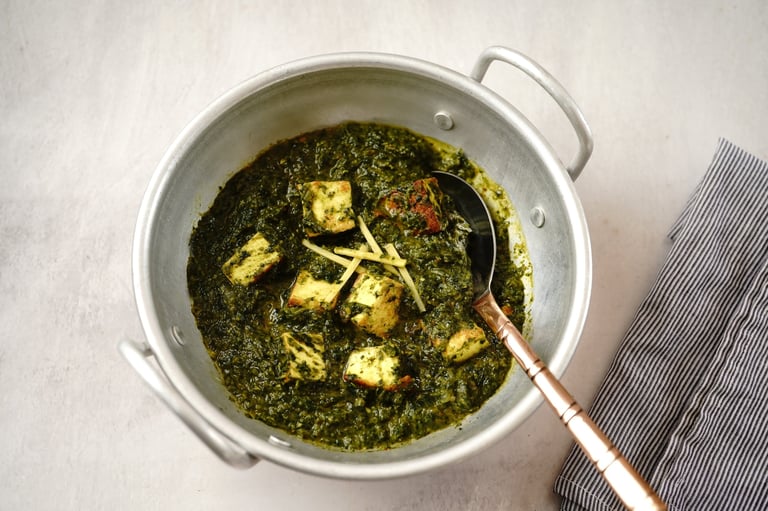 Palak paneer | Indian spinach cottage cheese curry served in a kadai, selective focus