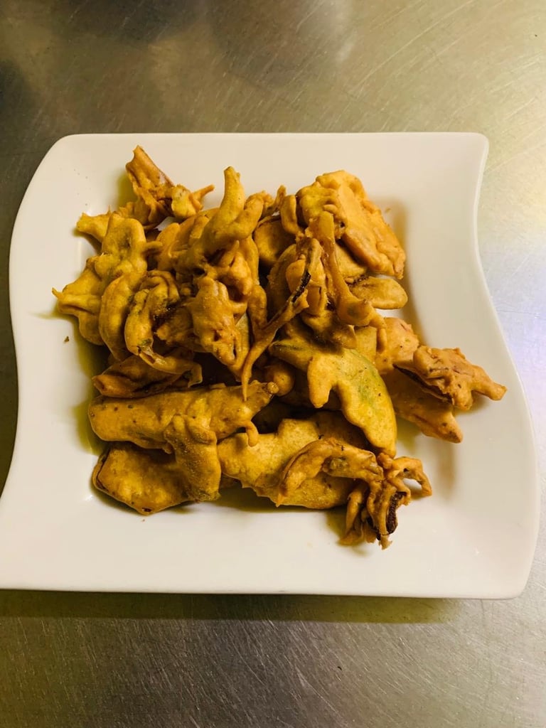 Crispy golden plantain chips served on a white square plate